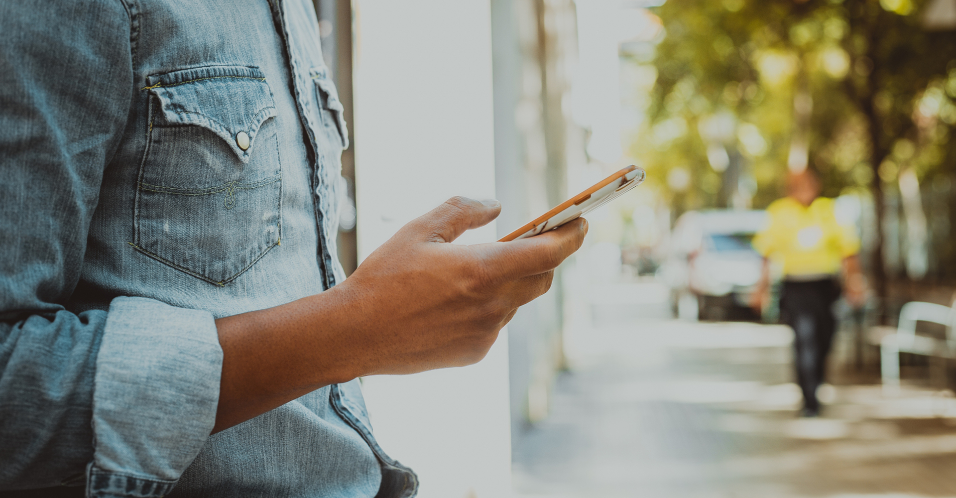 Image of a man looking at a phone
