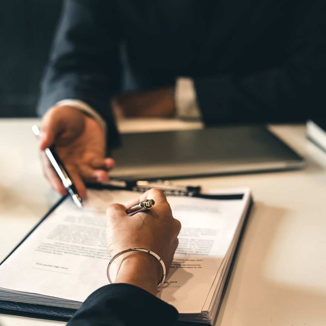 person signing a contract
