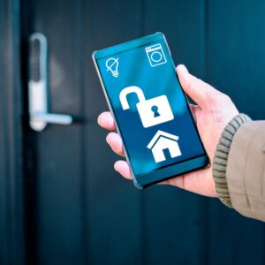 Person unlocking a smart lock with a phone. 
