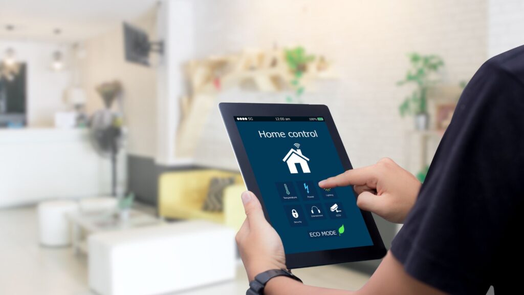 man using a tablet to access his smart home system.