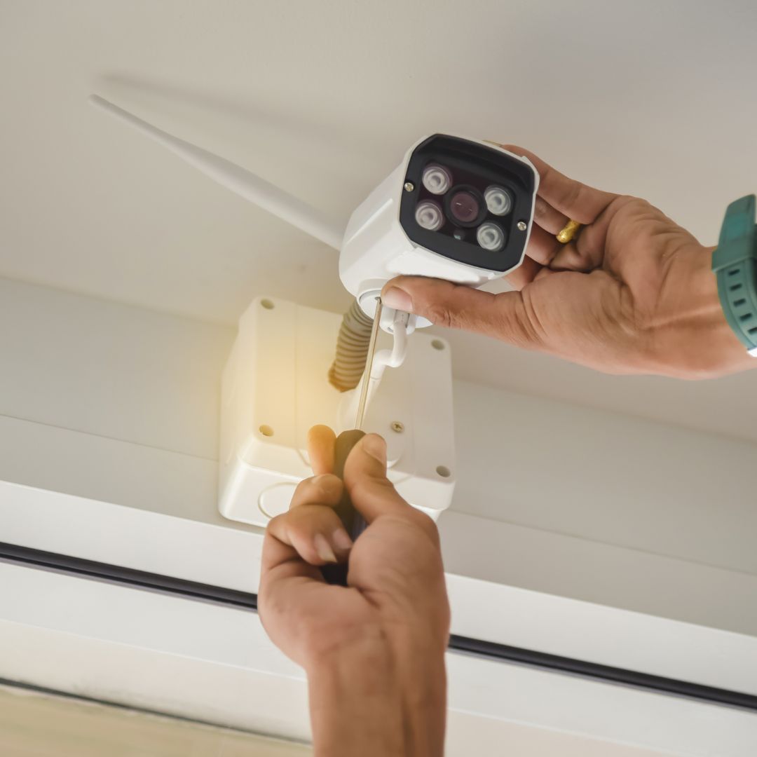 person installing a camera