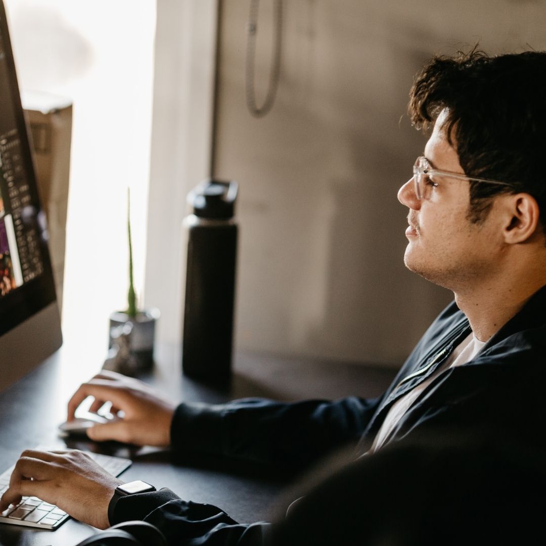 person looking at security camera feed on their computer